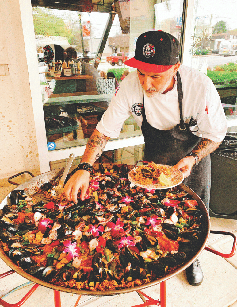 Chef Mimmo cooks paella on the patio every Wednesday.