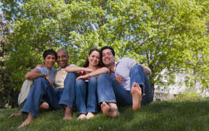 people sitting on a lawn