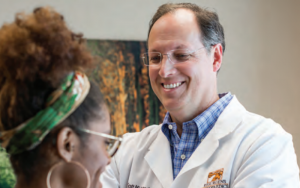 a doctor helping a patient