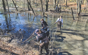 people cleaning up creek