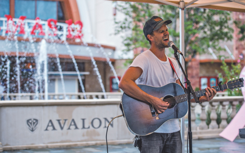 guy playing guitar and singing