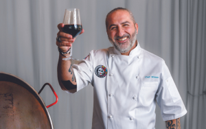 Chef Mimmo Alboumeh raises a glass for the new location of Botica