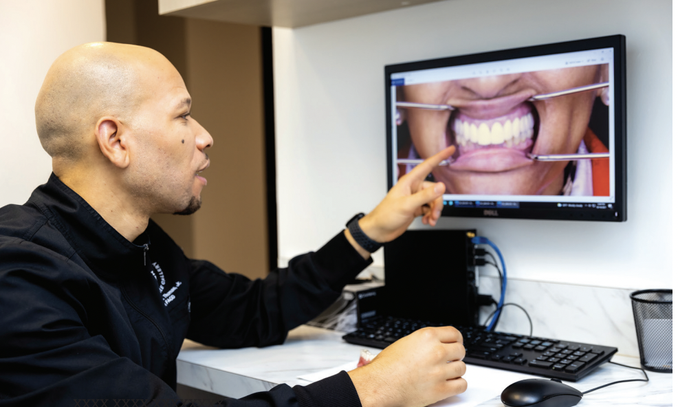 Dr. Michael A. Thomas Jr. looking at scans