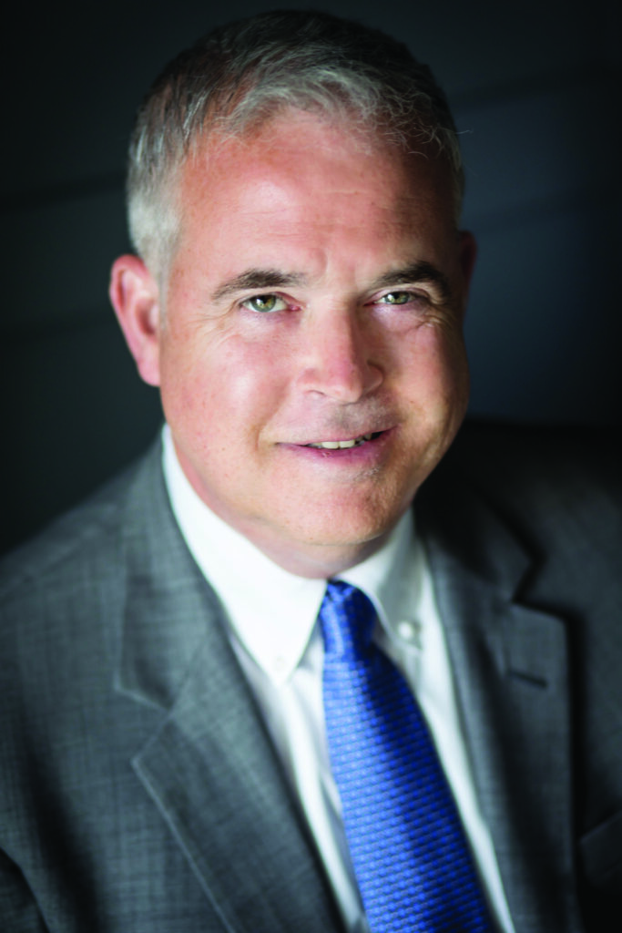 Man in suit, blue tie