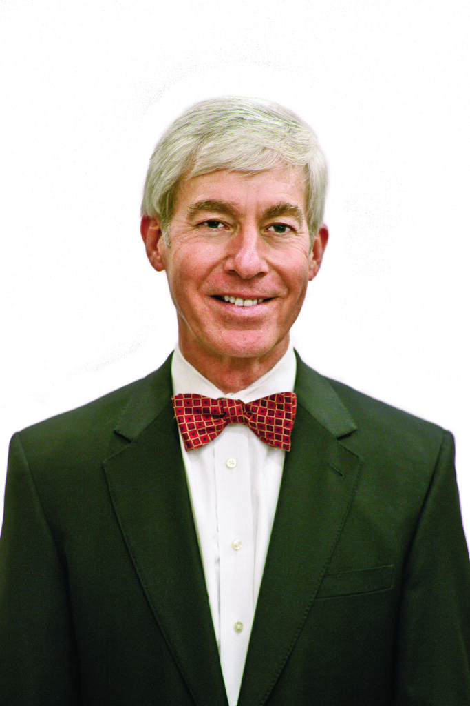 Man in suit with red bowtie