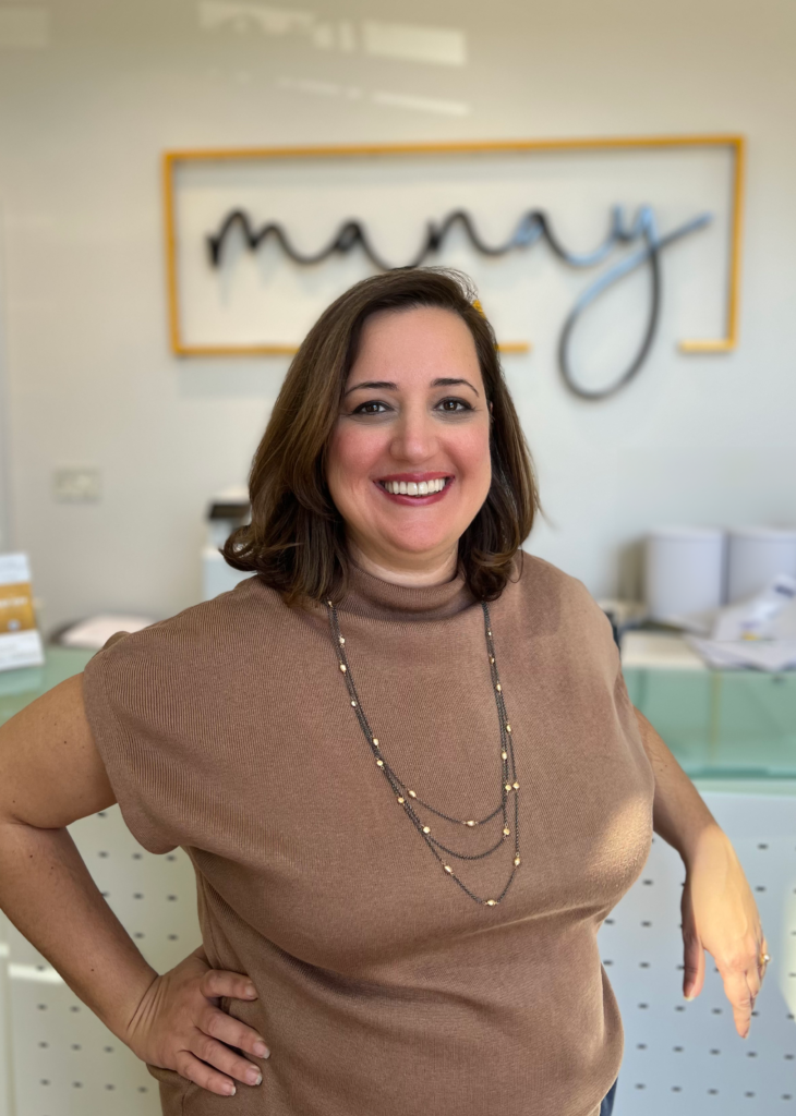 Woman in brown shirt smiling