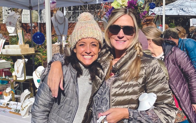 Women smiling at festival