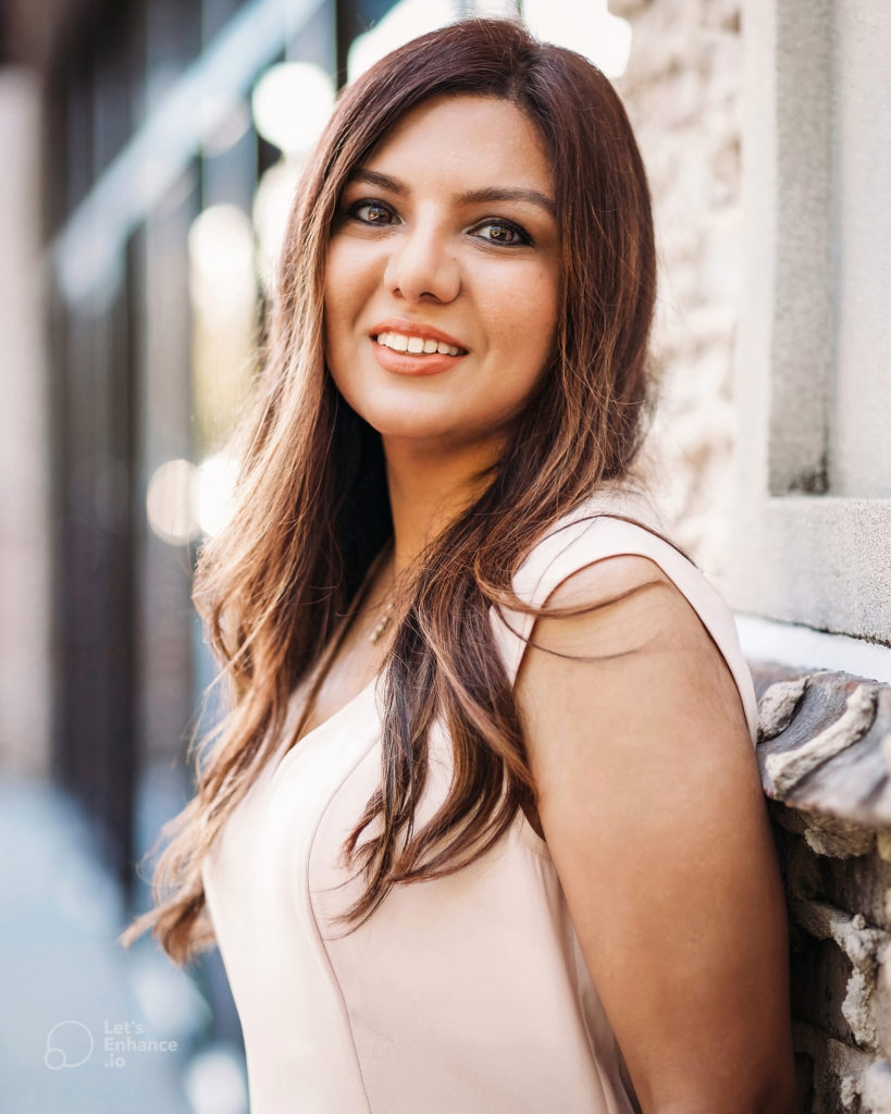 Brunette woman in pink headshot