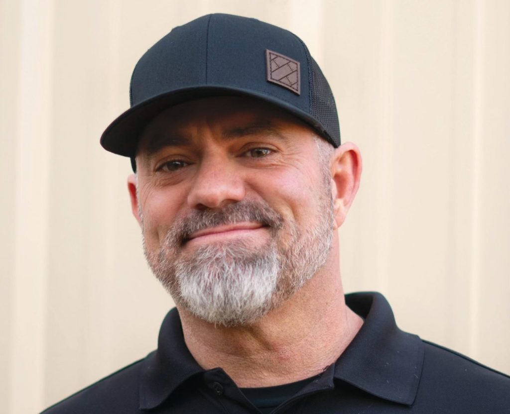 Man smiling in hat