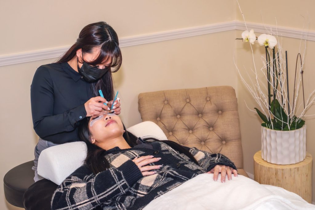 Woman getting eyelashes done