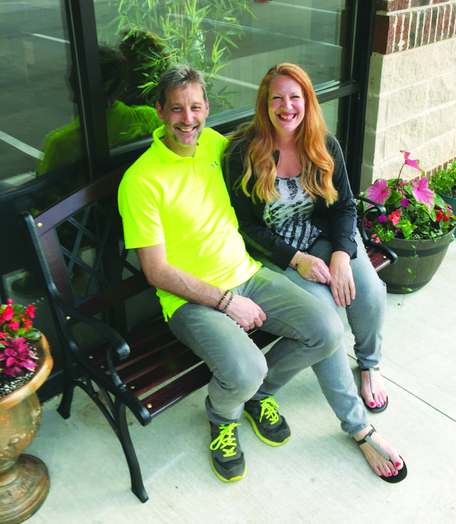 Man and woman sitting on a bench