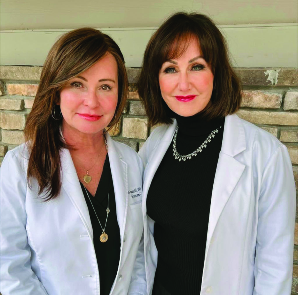 Two brunette women in white coats