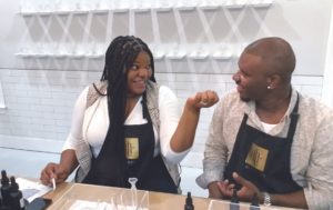 Man and women in black aprons chatting