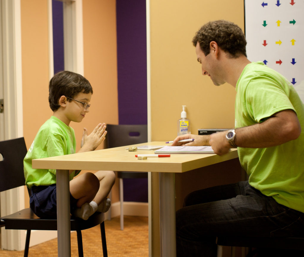 Man and boy at desk