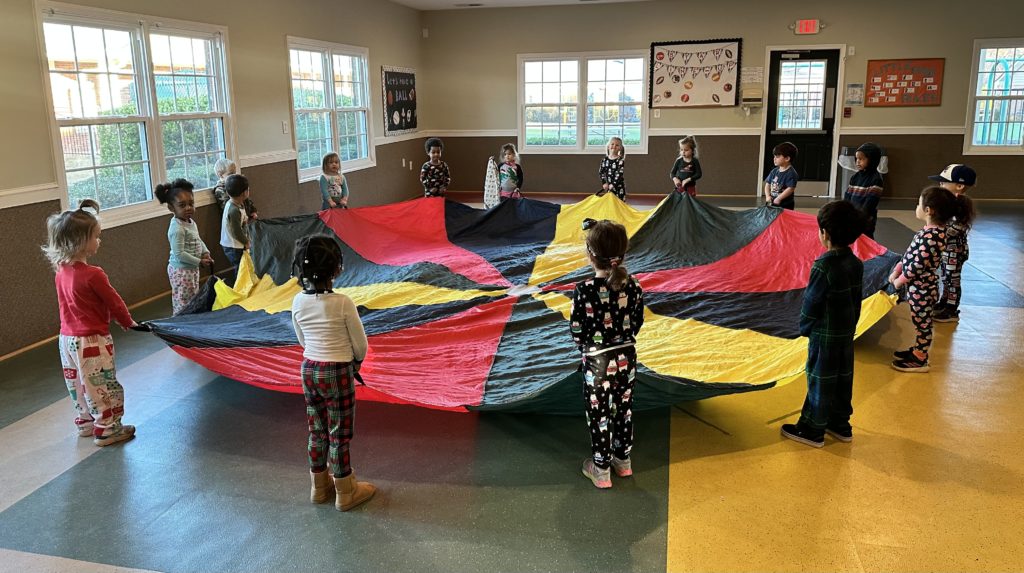 Kids with colorful parachute