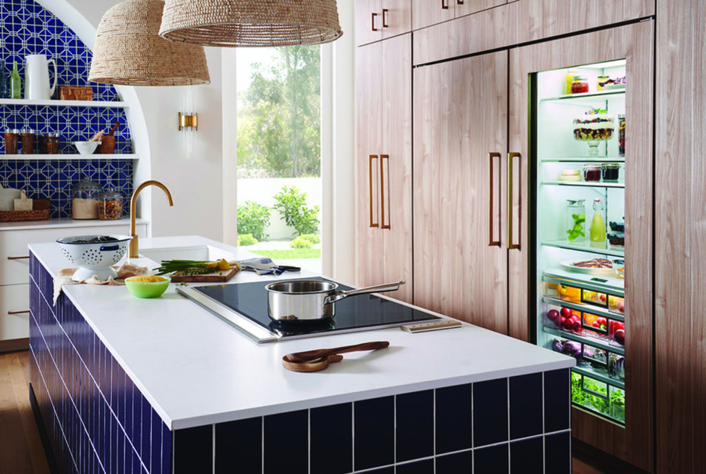Kitchen with white Island and navy blue tile