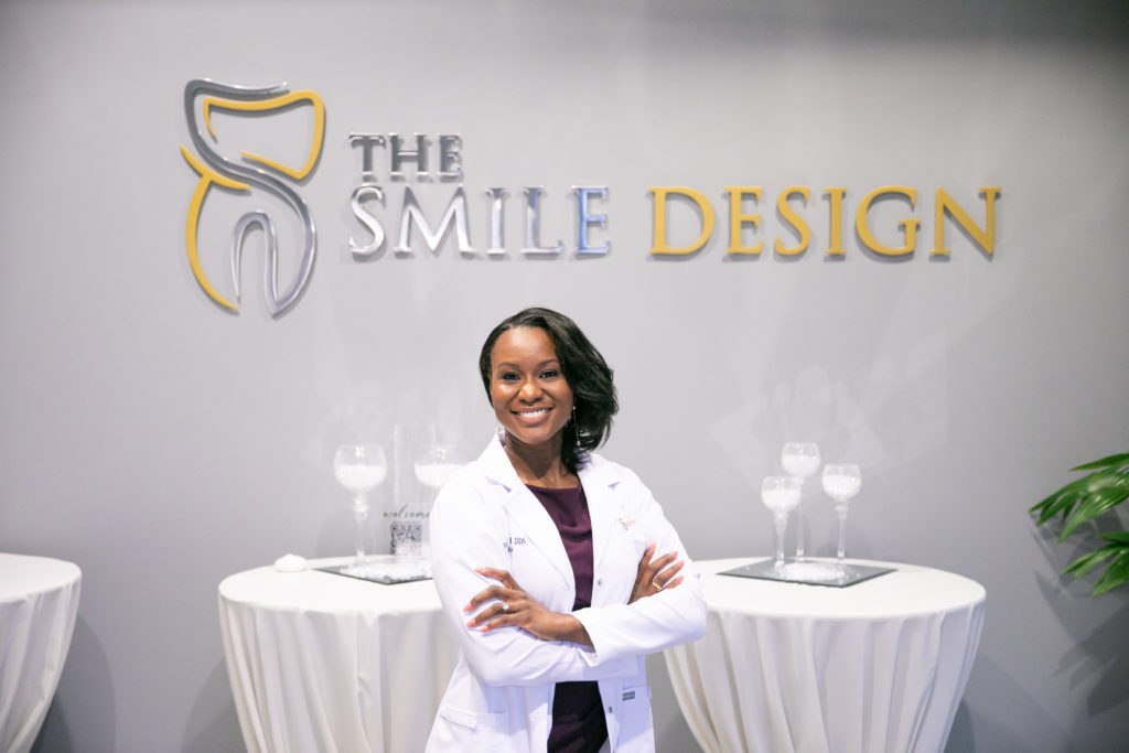 Woman in white lab coat at The Smile Design