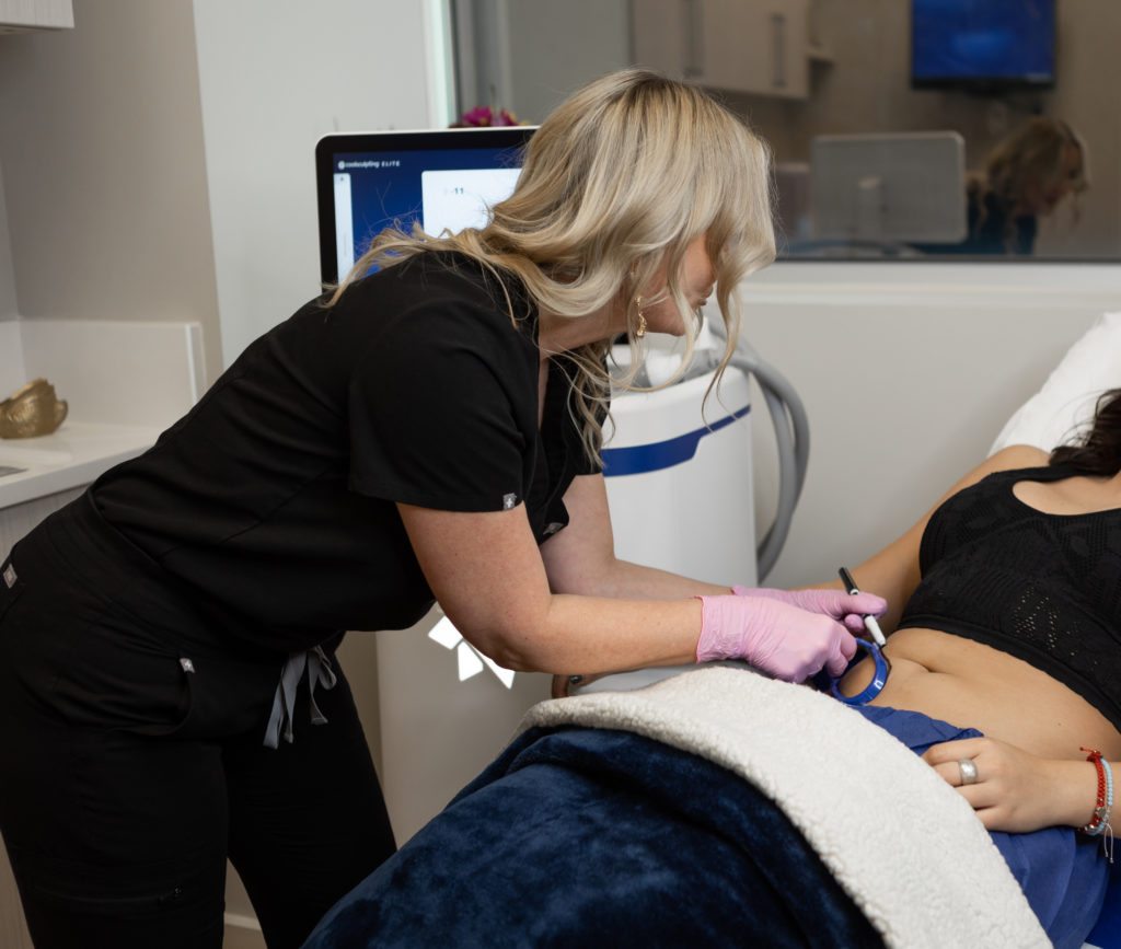 Woman touching patients stomach