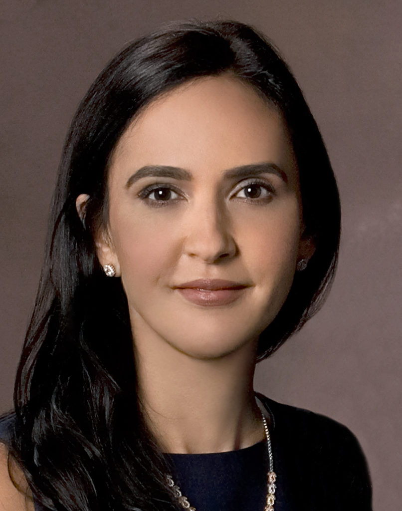 Woman with dark hair and black top