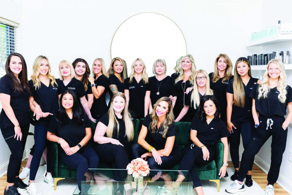 Group of women in black scrubs